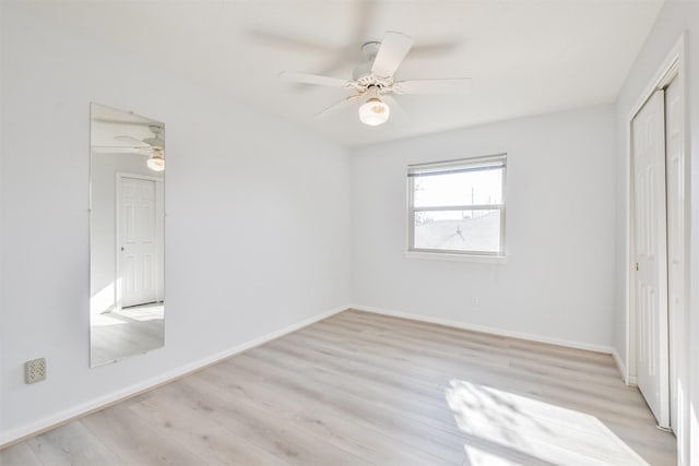 unfurnished bedroom featuring ceiling fan and light hardwood / wood-style flooring