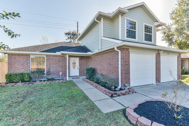 view of front property featuring a garage and a front yard