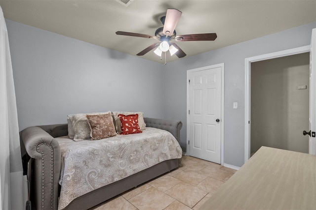 bedroom with light tile patterned floors and a ceiling fan