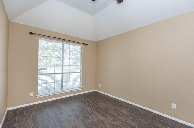 empty room with ceiling fan and vaulted ceiling