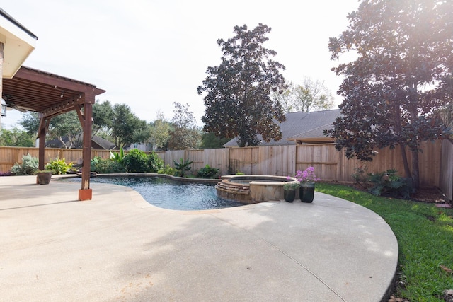 view of swimming pool featuring a patio area and an in ground hot tub