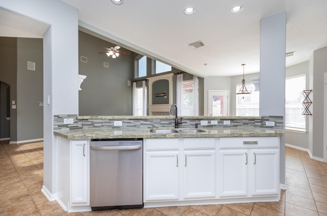 kitchen with pendant lighting, white cabinets, sink, stainless steel dishwasher, and ceiling fan