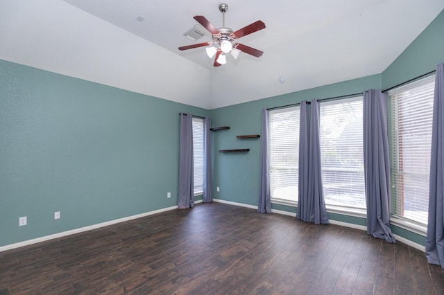 empty room featuring dark hardwood / wood-style floors, ceiling fan, and lofted ceiling