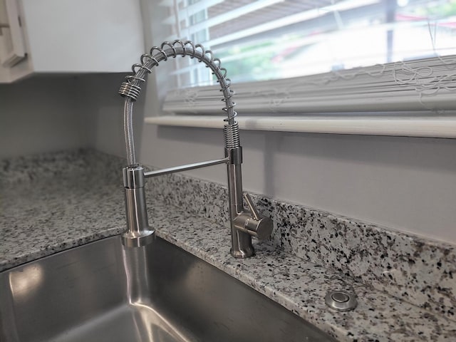 room details featuring light stone countertops