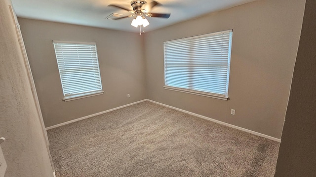 carpeted empty room with ceiling fan