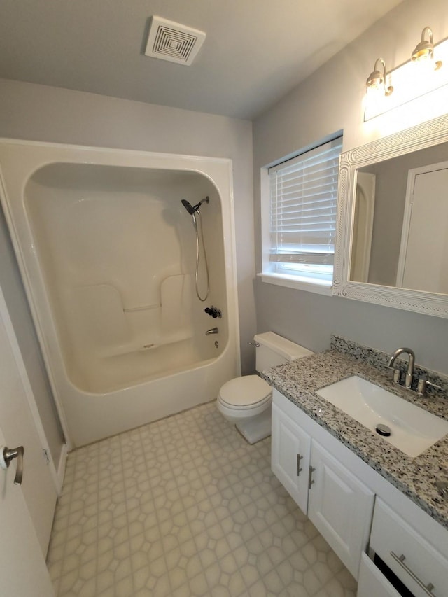 full bathroom with vanity, bathtub / shower combination, and toilet