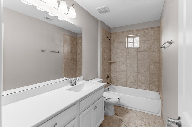 full bathroom with tile patterned flooring, vanity, toilet, and tiled shower / bath