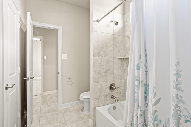 bathroom featuring toilet and shower / bath combination with curtain