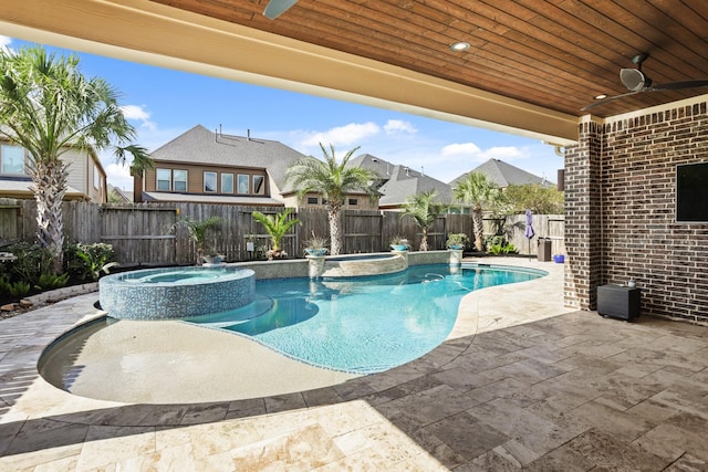 view of pool featuring ceiling fan, an in ground hot tub, and a patio