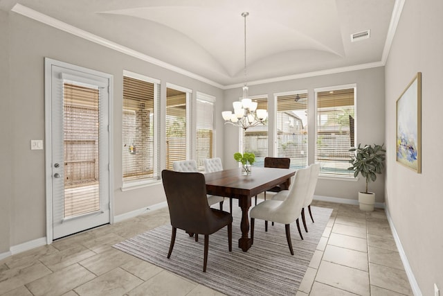 tiled dining room with a notable chandelier, vaulted ceiling, a wealth of natural light, and ornamental molding