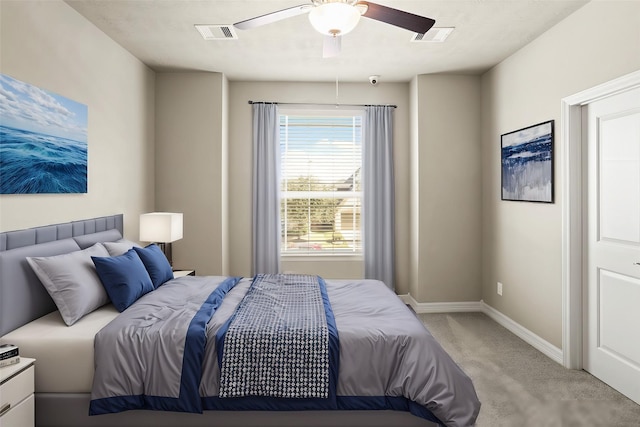 bedroom featuring ceiling fan and light carpet