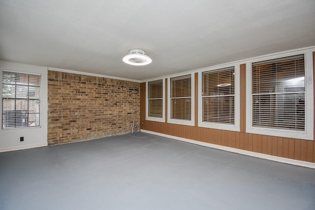 interior space with brick wall and wooden walls