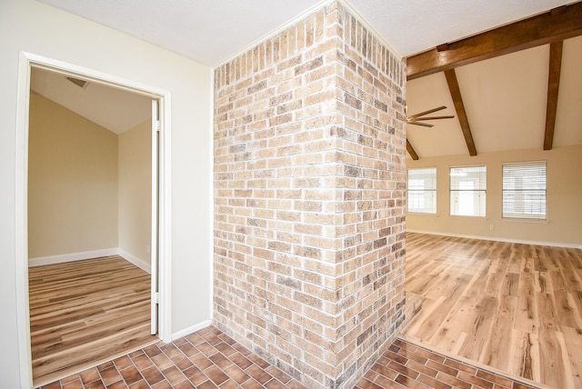 interior space featuring lofted ceiling with beams