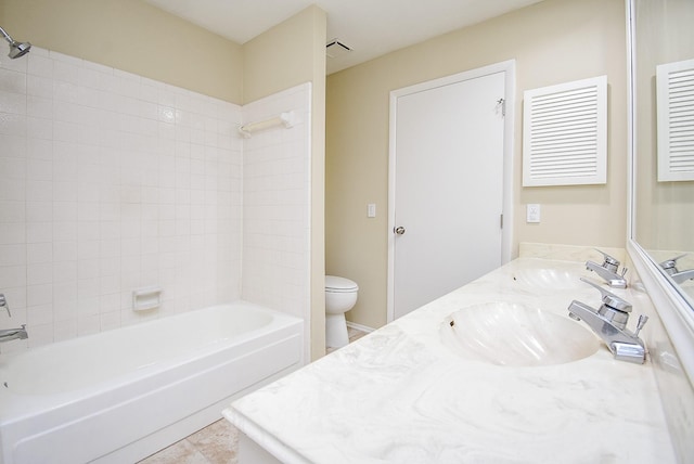 full bathroom featuring tile patterned floors, vanity, bathtub / shower combination, and toilet