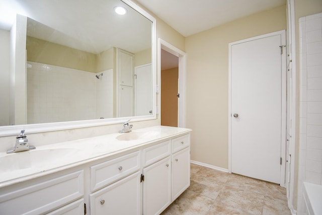 bathroom featuring vanity and shower / bathtub combination