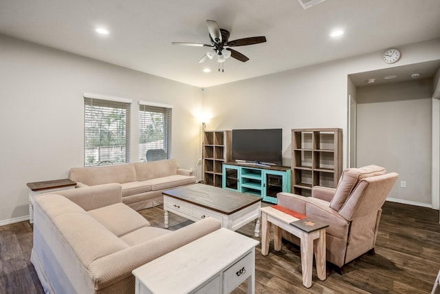 living room featuring ceiling fan and dark wood-type flooring