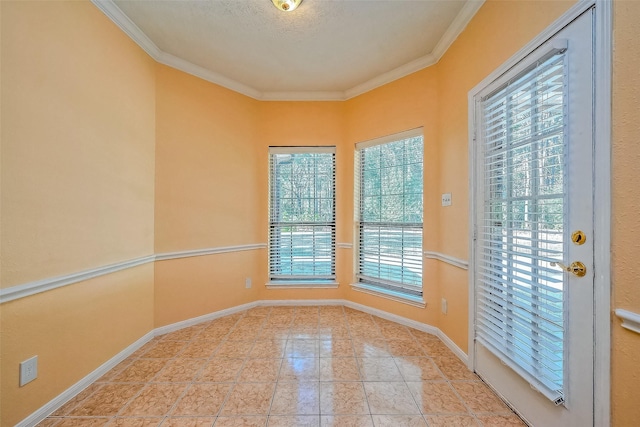 interior space with a textured ceiling, a wealth of natural light, crown molding, and light tile patterned flooring