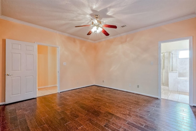 unfurnished room featuring hardwood / wood-style floors, ceiling fan, ornamental molding, and a textured ceiling