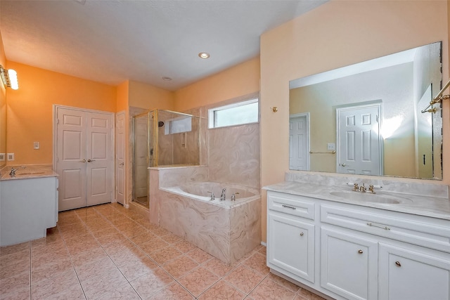 bathroom with vanity, tile patterned flooring, and plus walk in shower