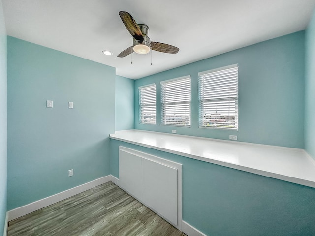 interior space with ceiling fan, plenty of natural light, and light hardwood / wood-style floors