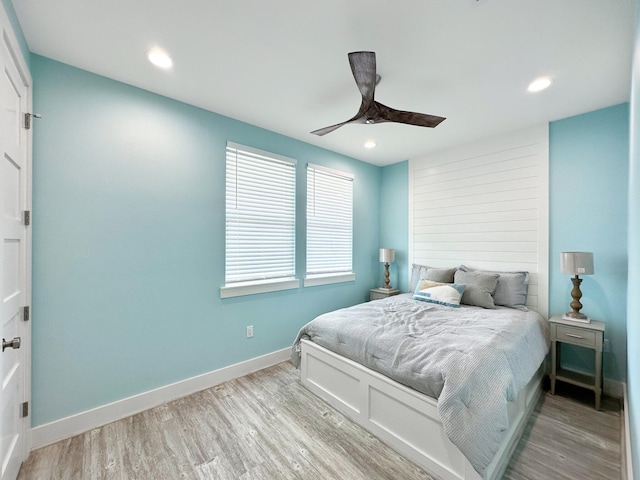 bedroom featuring ceiling fan and light hardwood / wood-style floors