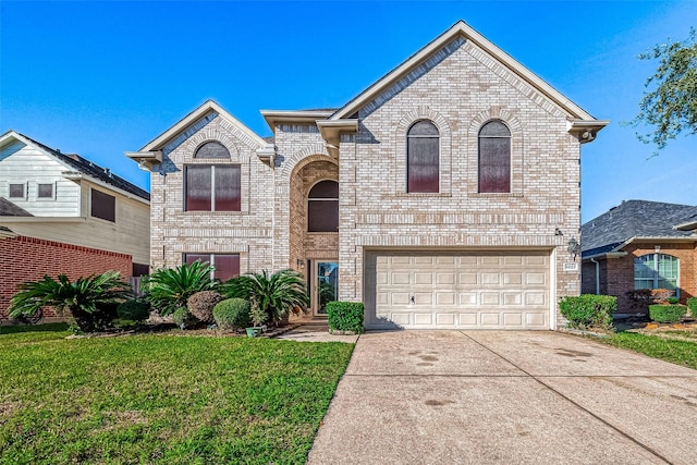 view of front of home featuring a garage and a front lawn