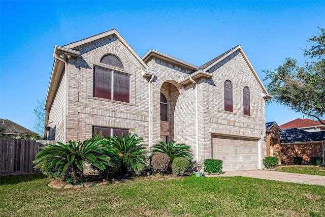 view of front facade featuring a garage and a front lawn