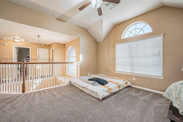 bedroom featuring carpet floors, vaulted ceiling, and ceiling fan