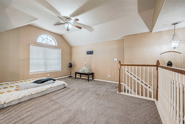 bedroom with carpet flooring, vaulted ceiling, and ceiling fan