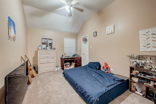 carpeted bedroom featuring ceiling fan and vaulted ceiling