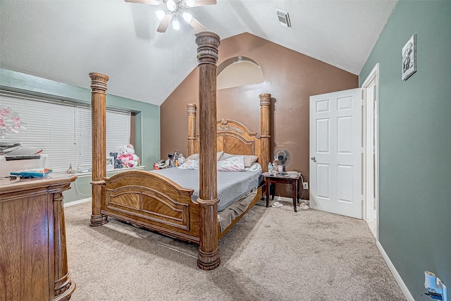 carpeted bedroom with vaulted ceiling and ceiling fan