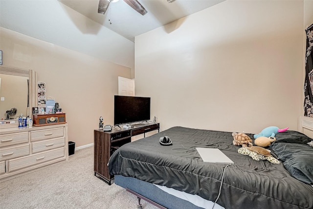 carpeted bedroom with vaulted ceiling and ceiling fan