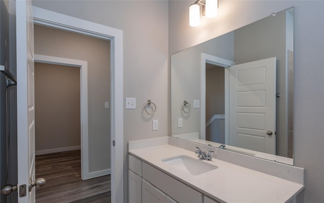 bathroom featuring vanity and wood-type flooring