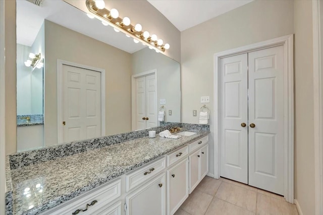 bathroom featuring tile patterned floors and vanity