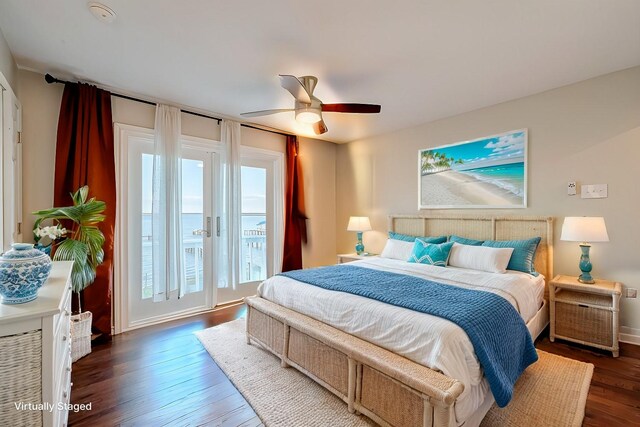 bedroom with ceiling fan, dark hardwood / wood-style floors, and access to outside