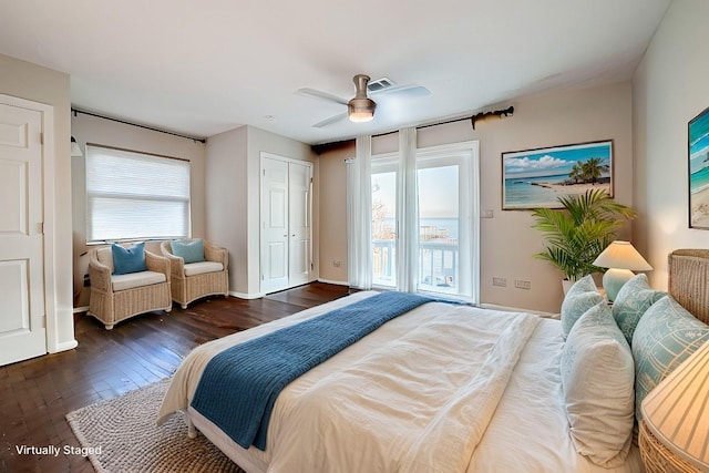 bedroom with ceiling fan, access to exterior, and dark hardwood / wood-style flooring