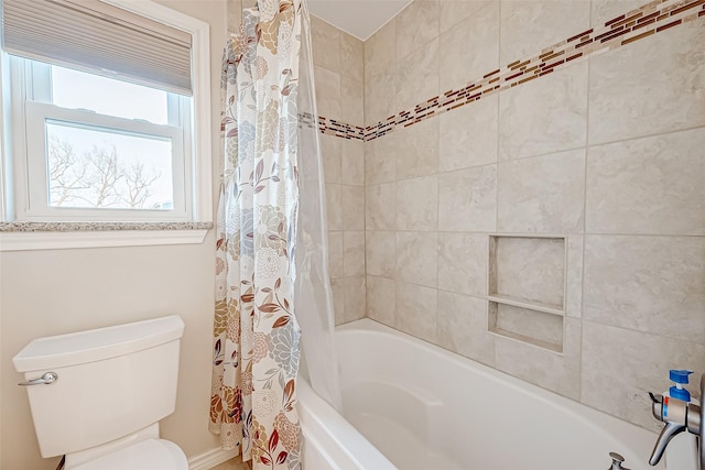 bathroom featuring toilet and shower / bathtub combination with curtain