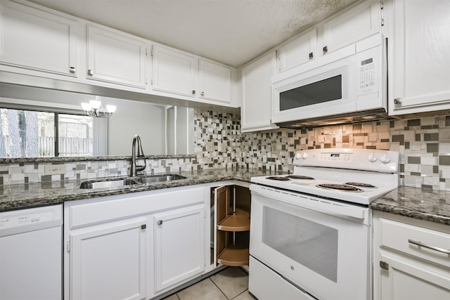 kitchen with white cabinets, white appliances, and sink