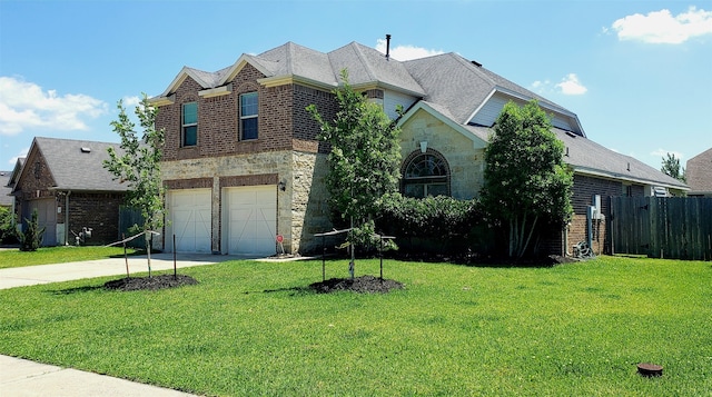 view of front of house with a front lawn and a garage