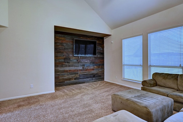 living room featuring carpet flooring, high vaulted ceiling, and plenty of natural light