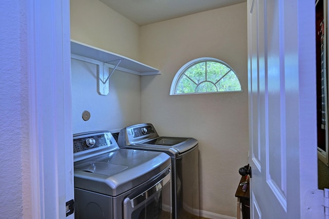 laundry room with washing machine and clothes dryer