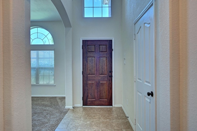 view of carpeted foyer