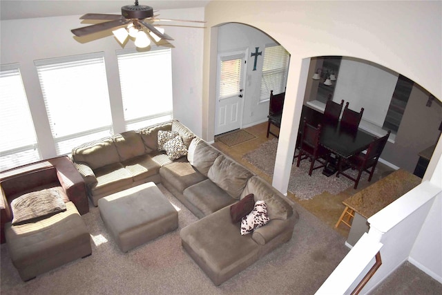 carpeted living room featuring ceiling fan