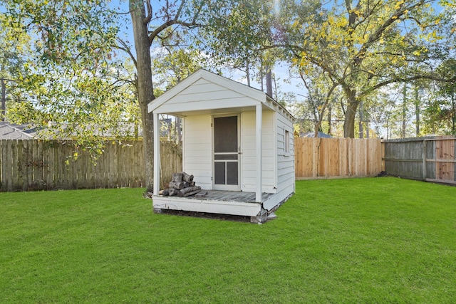 view of outbuilding featuring a lawn