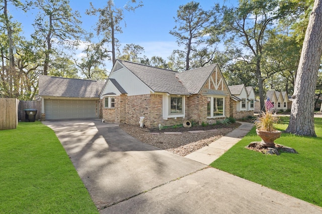 view of front of house with a front yard and a garage