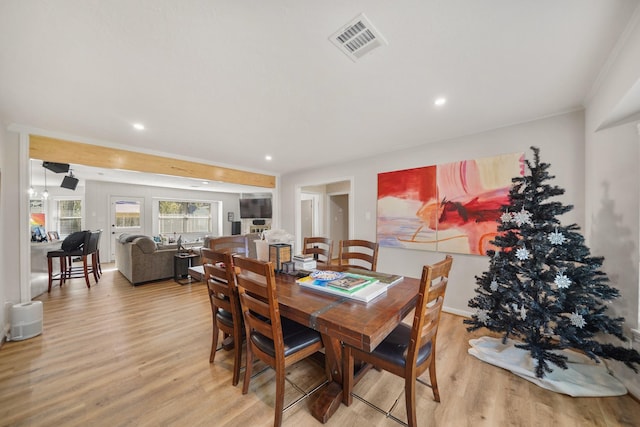 dining room with light hardwood / wood-style flooring