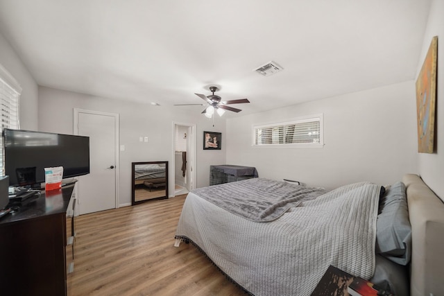 bedroom with ceiling fan and wood-type flooring