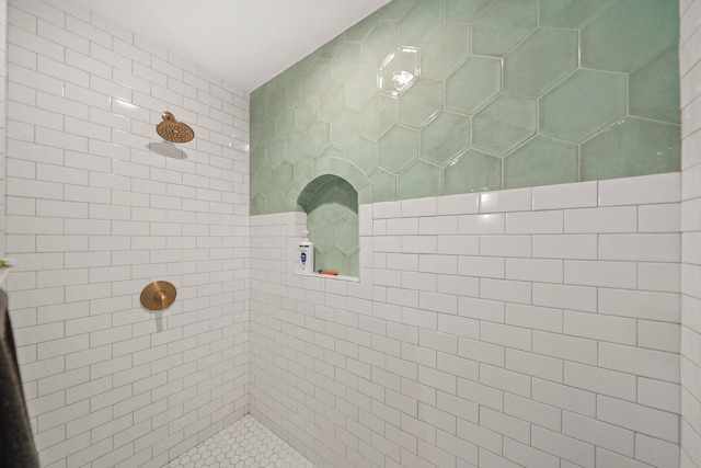 bathroom with tiled shower