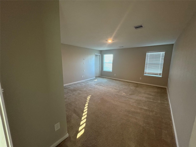 spare room with carpet floors