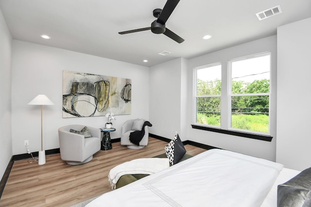 bedroom featuring hardwood / wood-style flooring and ceiling fan